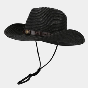 Detail of black straw cowboy hat featuring brown leather band with sunburst studs