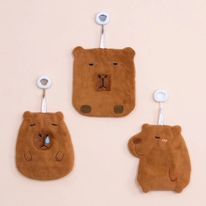 Hanging capybara hand towels in brown coral fleece with cute animal face designs