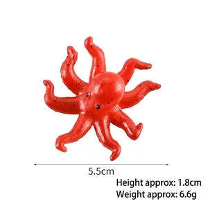 Realistic red PVC octopus keychain pendant with textured finish 5.5cm wide and 1.8cm high