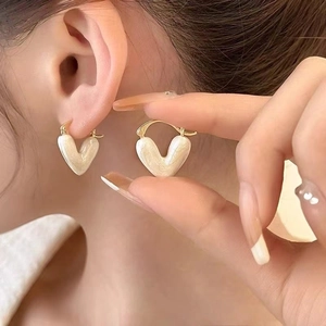 Elegant pearl white heart shaped drop earrings with gold tone clasps for women