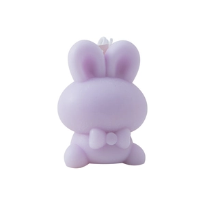Cute purple bunny scented candle with a bow tie decoration on a clean white background