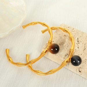 Elegant gold bamboo joint open choker necklace set with tiger eye and black beads