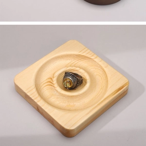 Detail view of square solid wood jewelry tray with round groove for rings and bracelets
