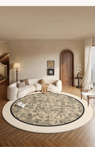 Detail of round Butterfly Garden carpet with black floral patterns on beige surface