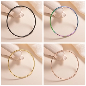 Minimalist 2mm stainless steel bangles in black, rainbow, gold and rose gold finishes