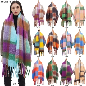 Women's thick plaid scarf with tassels in thirteen color patterns shown on model and bust