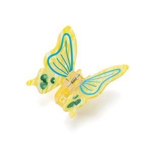 Elegant butterfly acetate hair claw clip with colorful spotted pattern on white background