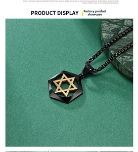 Close-up of hexagonal stainless steel pendant with golden star on green marble