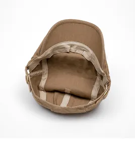 Detail view of cotton twill beret interior featuring adjustable metal buckle and soft sweatband