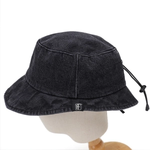 Detail of denim bucket hat featuring adjustable drawstring and woven logo label
