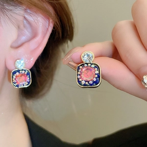 Vintage gold square earrings with pink gemstone, blue enamel, and silver pins