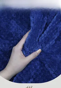 Close-up of thick royal blue flannel fabric showing soft cashmere-like plush texture