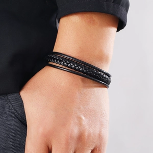 Men's multilayer braided black leather bracelet with stainless steel clasp on wrist