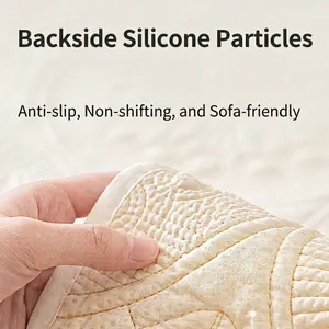 Quilted cream washed cotton sofa cover with non-slip silicone backing and edging