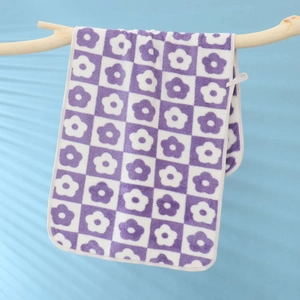 Detail showing soft coral fleece purple and white checkered floral microfiber towel