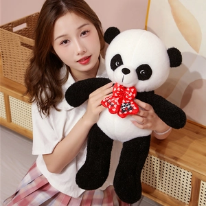 Close-up of a plush panda doll with a red bowtie featuring 'Love' text and heart print