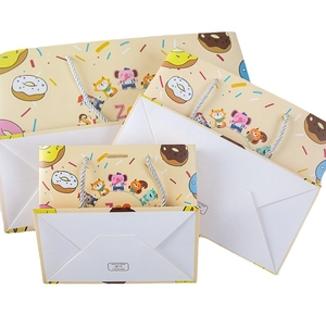 Cartoon animal paper gift bags with colorful donut prints for kids birthdays