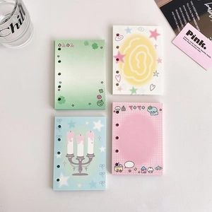 Detailed view of colorful star-patterned 6-hole loose-leaf paper refills for journals