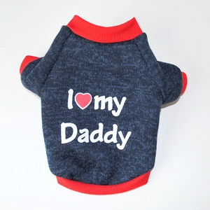 Detail of knit dog sweater featuring I Heart My Daddy text with red ribbed cuffs