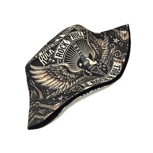 Detailed close-up of rock and roll graffiti prints with electric guitar on canvas bucket hat