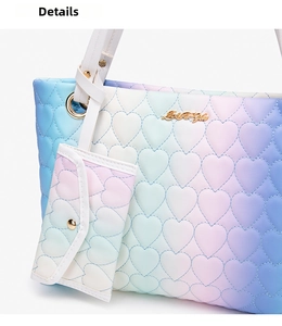 Close-up of heart-shaped quilting and rainbow gradient texture on this large tote bag