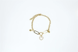 Detail of gold chain bracelet with heart pendant and adjustable toggle clasp link