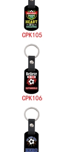 Detailed view of leather football keychains with inspirational quotes on black metal tags