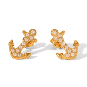 Detailed macro of 18K gold-plated anchor earrings with sparkling cubic zirconia inlay