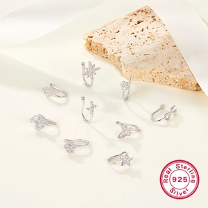 Macro view of 9-piece 925 sterling silver nose ring set with sparkling cubic zirconia stars