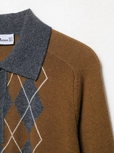 Detailed close-up of brown knit polo sweater featuring grey diamond patterns and collar