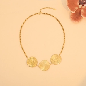 Detail of gold geometric irregular pendant necklace with textured rings and S925 clasp