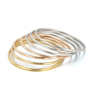 Polished 3mm stainless steel stackable bangle set in gold, rose gold and silver