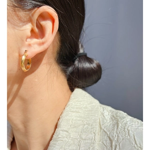 Elegant gold-plated snake-textured hoop earrings for women with a minimalist vintage style