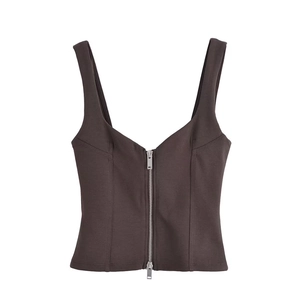 Detail of dark brown tight vest featuring a metallic silver zipper and V-neck cut