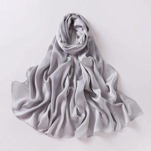 Close-up of silver-grey chiffon silk shawl showing soft texture and elegant drape