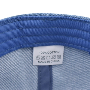 Detail shot of the NYC baseball cap interior showing the 100% cotton label and stitching