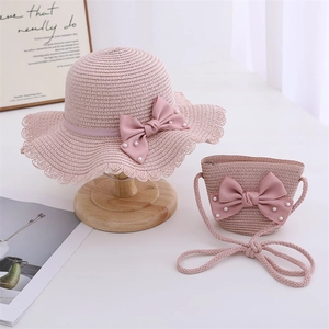 Girls pink straw hat and crossbody bag set with satin bow and pearl accents