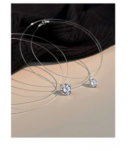 Detailed view of S925 sterling silver mermaid tear pendant on invisible fishing line chain