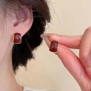 Retro burgundy rectangular earrings with gold metal frame shown on model for daily wear