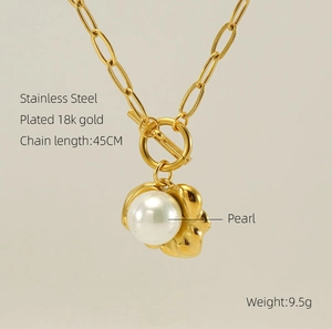 Close-up of 18K gold plated stainless steel paperclip chain with white pearl and OT toggle clasp
