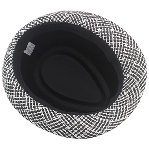 Macro view of woven paper straw texture with inner sweatband and size label for jazz hat