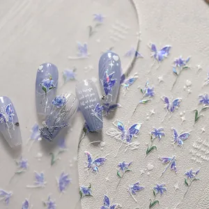 Detailed holographic butterfly and rose nail art stickers with metallic accents