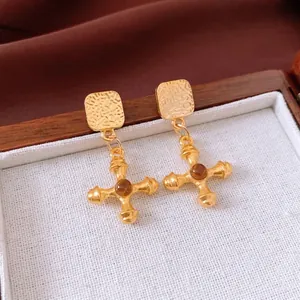 Vintage gold cross earrings with amber beads and hammered texture in a luxury gift box