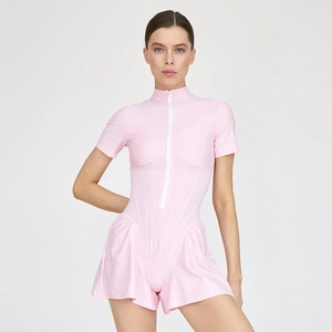 Detailed view of pink short sleeve bodysuit featuring a front zipper and flared skirt hem