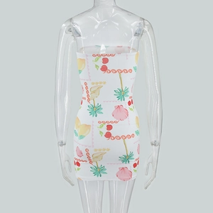 Detail of white strapless bodycon dress with vibrant cherry and lemon summer prints