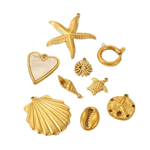 9pcs gold stainless steel marine pendants featuring starfish, shell, and heart designs