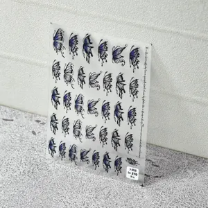 Detailed sheet of thin adhesive 5D nail stickers featuring blue and purple butterfly designs