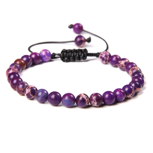 Detail of 6mm purple stone beaded bracelet with black adjustable braided cord