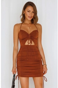 Detail of caramel halter mini dress featuring hollow-out chest design and side drawstrings