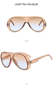 Detailed front and side view of oversized aviator sunglasses in light tea blue gradient